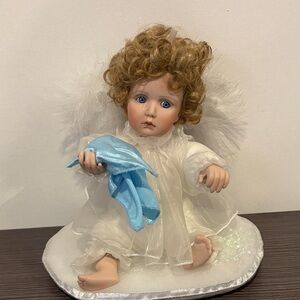 Porcelain Angel Doll with Blue Blanket